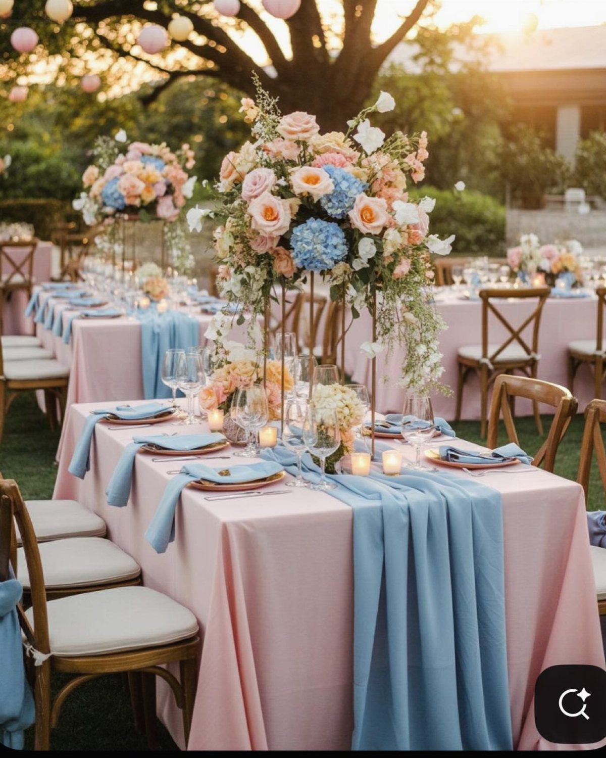 Wedding tables with pink linens, blue runners, and pink and blue floral centerpieces.